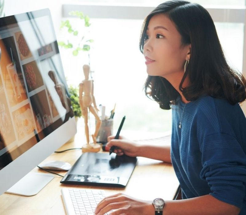 Woman at desk working on computer